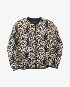 Chaqueta acolchada beige y negra