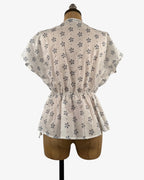 Blusa volantes blanca florecitas